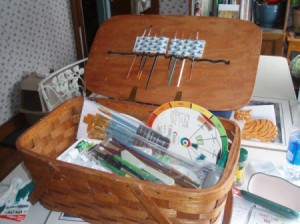 Picnic basket used to hold art supplies.