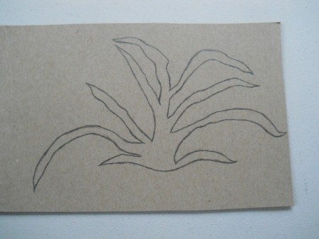 Larger back layer of carrot top transferred to cardboard for final template.