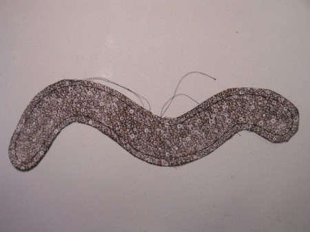 Stitched bookworm before turning right sides out.