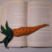 Carrot page weight on open book