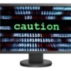 Computer screen says "Caution".