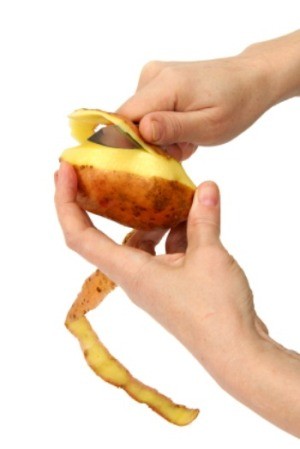 Peeling a potato.