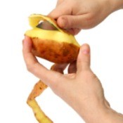 Peeling a potato.