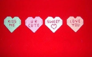 Plastic canvas heart magnets.