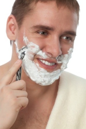 A man shaving.