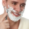 A man shaving.