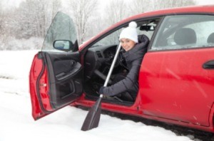 A girl trying to drive on snow and ice.