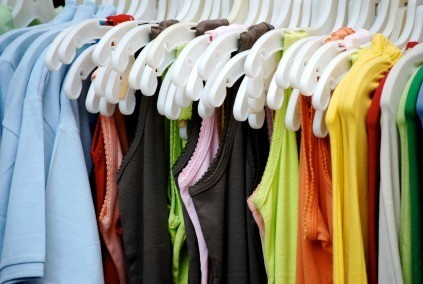 Clothing hung up on a bar.