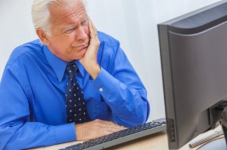 A man having trouble with his computer.