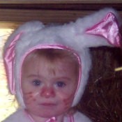 A toddler in a bunny costume.