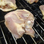 raw chicken on grill