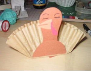 Brown coffee filter and construction paper turkey.