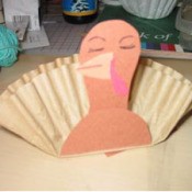 Brown coffee filter and construction paper turkey.