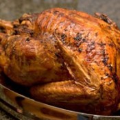 A roast turkey in a pan.