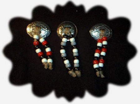 Three pins made from western conchos and beads.