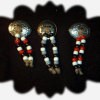Three pins made from western conchos and beads.