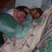 CoCo lying with child.