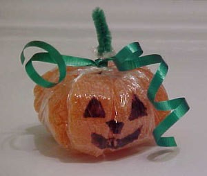 A cute candy pumpkin made from orange slices.