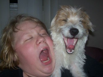 A boy and dog howling together
