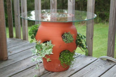 Strawberry pot with a glass table top.