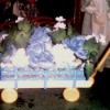 Floral arrangement in wagon.