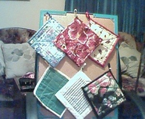 Potholders on bulletinboard.