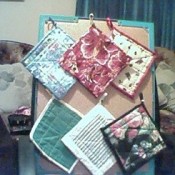 Potholders on bulletinboard.