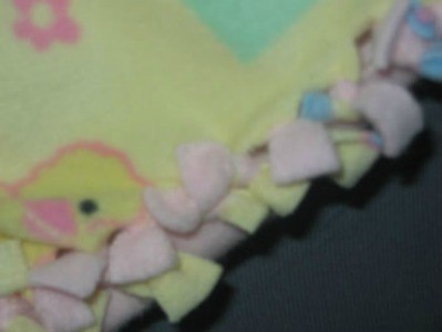 Yellow print fleece doll blanket.