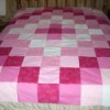 A homemade patchwork quilt topper