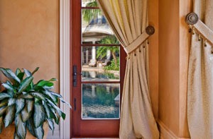 Window with curtain and tiebacks.