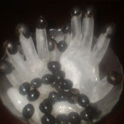 olives on frozen hand forms