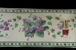 Border with purple flowers, maybe violets.