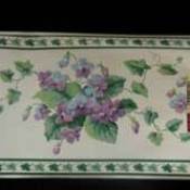 Border with purple flowers, maybe violets.