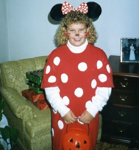 A girl in a Minnie Mouse costume.