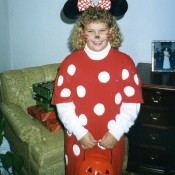 A girl in a Minnie Mouse costume.