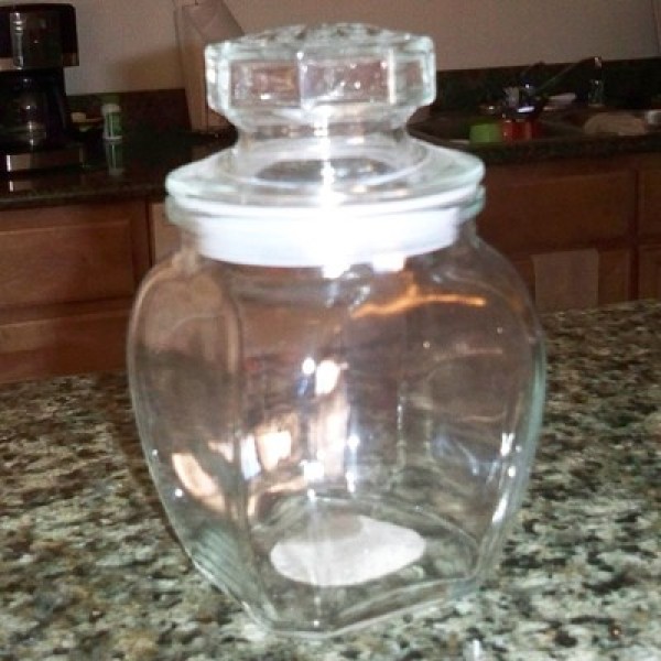 A small clear glass jar.
