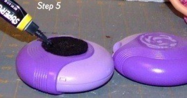 Putting glue on a purple Advair inhaler.