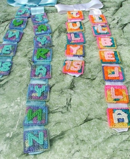 Plastic canvas letter ribbons.