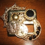 A brooch made from recycled jewelry pieces.