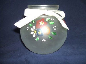Painted votive candle holder.