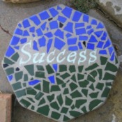Mosaic Stepping Stone - using blue and green pieces and the word "Success" in center
