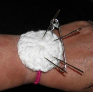 Finished pin cushion on makers wrist.