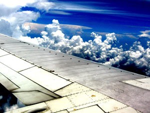 clouds above airplane wing