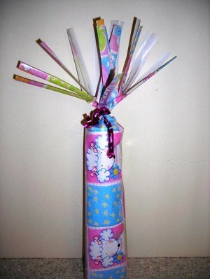 Gift wrapped cylinder.