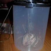 Side view of yarn ball in container.