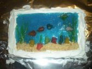A cake made with blue jello to mimic an aquarium.