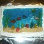 A cake made with blue jello to mimic an aquarium.