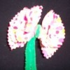 A flower made from fabric and chenille pipe cleaners.