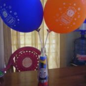 bottle picture of Thomas the Train inside and two balloons