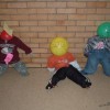 Scarecrows made with toddler clothing and balloon heads.